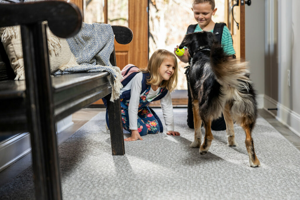 Kids playing with dog on carpet floor | Havertown Carpet